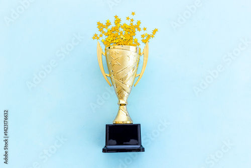 Award golden trophy cup as a symbol of victory. Winning the competition concept