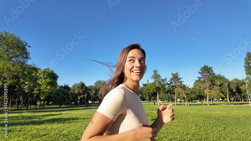 Obraz na płótnie Young woman running and jogging in urban park. w salonie