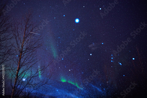 Obraz na płótnie Aurora borealis, polar lights with Milky Way stars. w salonie
