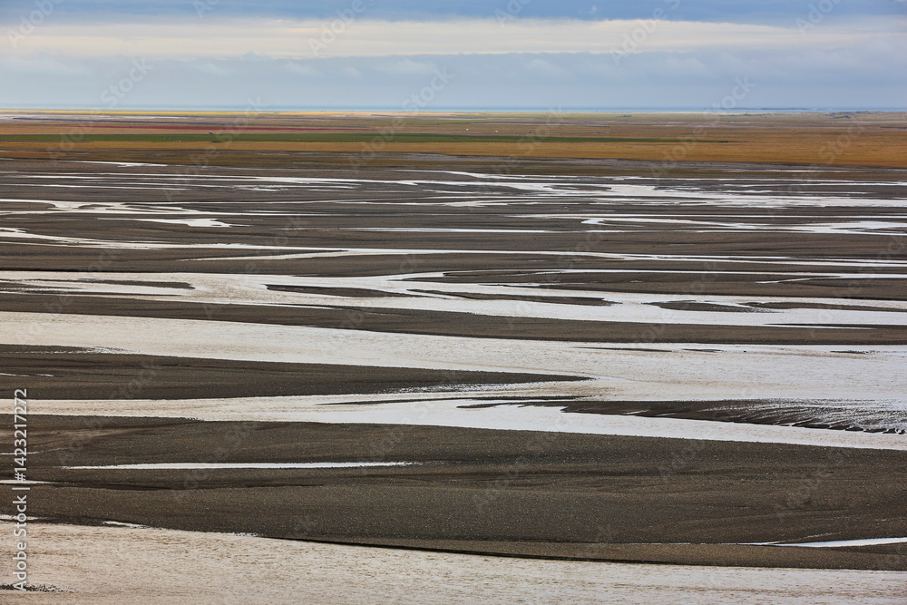 Water and sand from glaciers landscape. Lonsvik. East fjords. Iceland