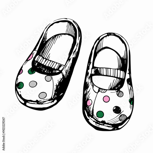 Whimsical baby shoes with colorful polka dots resting on a clean background representing childhood innocence and playful style.