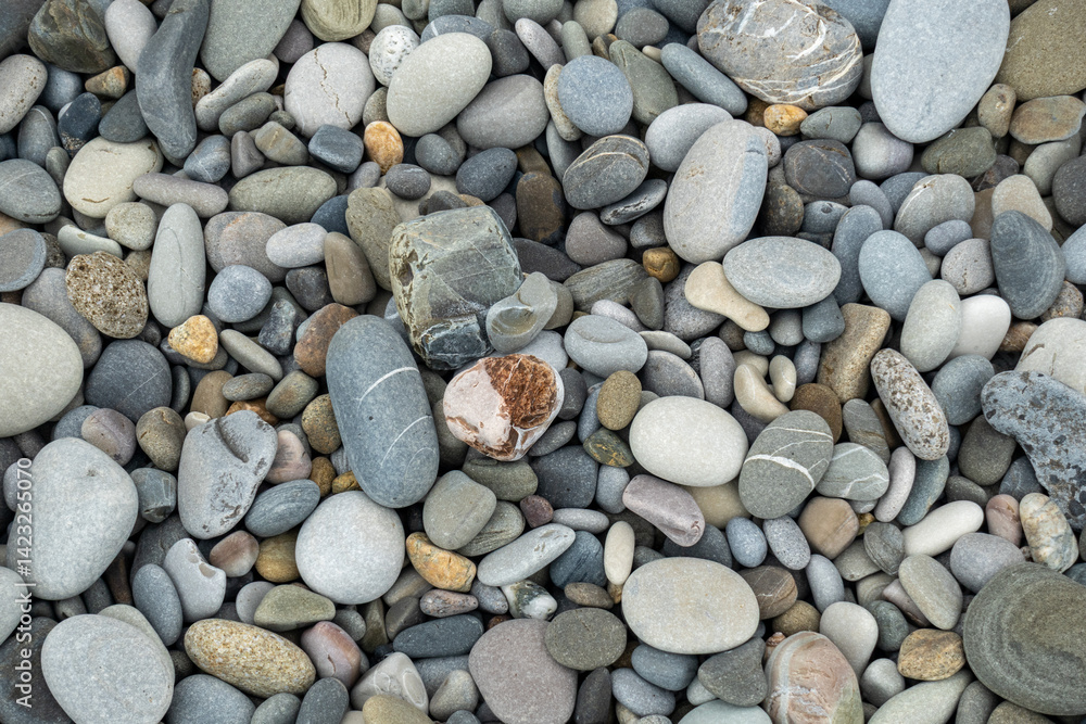 A pile of rocks with a single rock in the middle A pile of rocks with a single rock in the middle