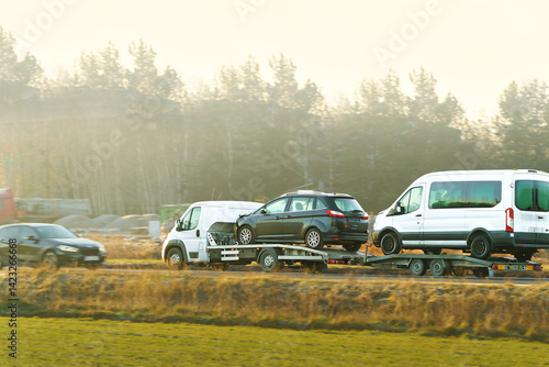 Tow truck transporting car after breakdown
