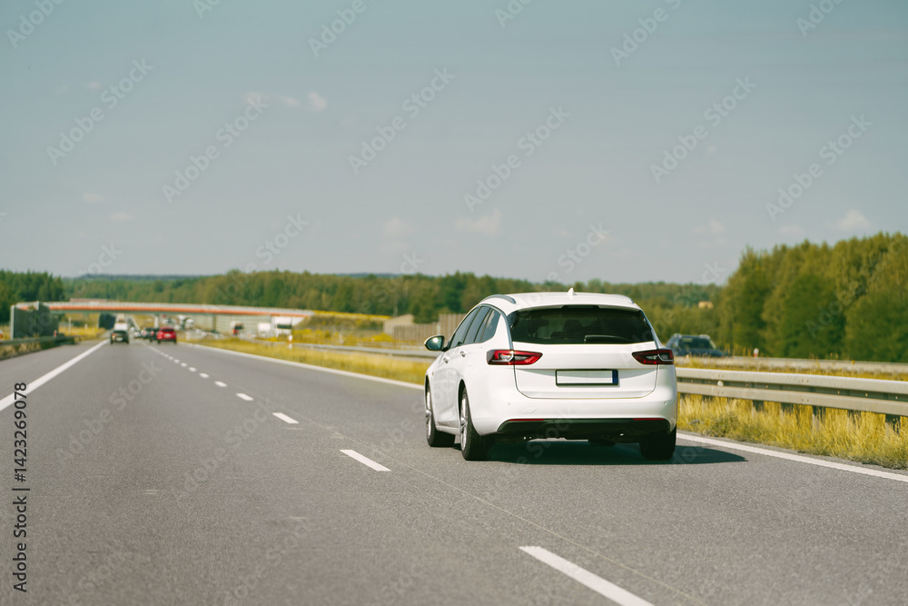 European combi car on a long empty road