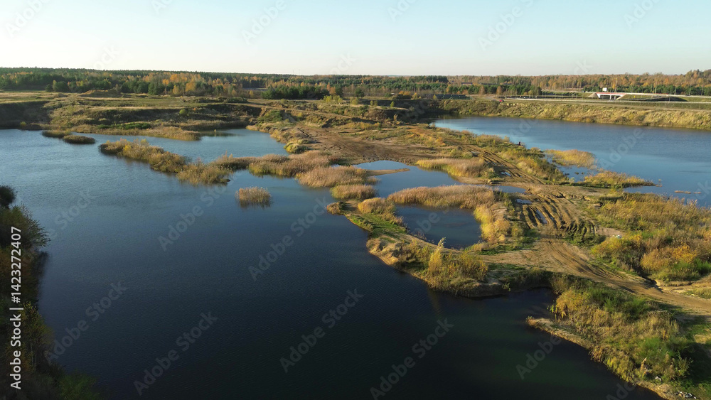 Aerial shot of lake surrounded by nature