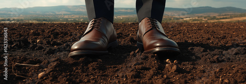 Obraz na płótnie business shoes of a businessman standing on agricultural soil in Kibbutz Kfar Baruch, Israel. w salonie