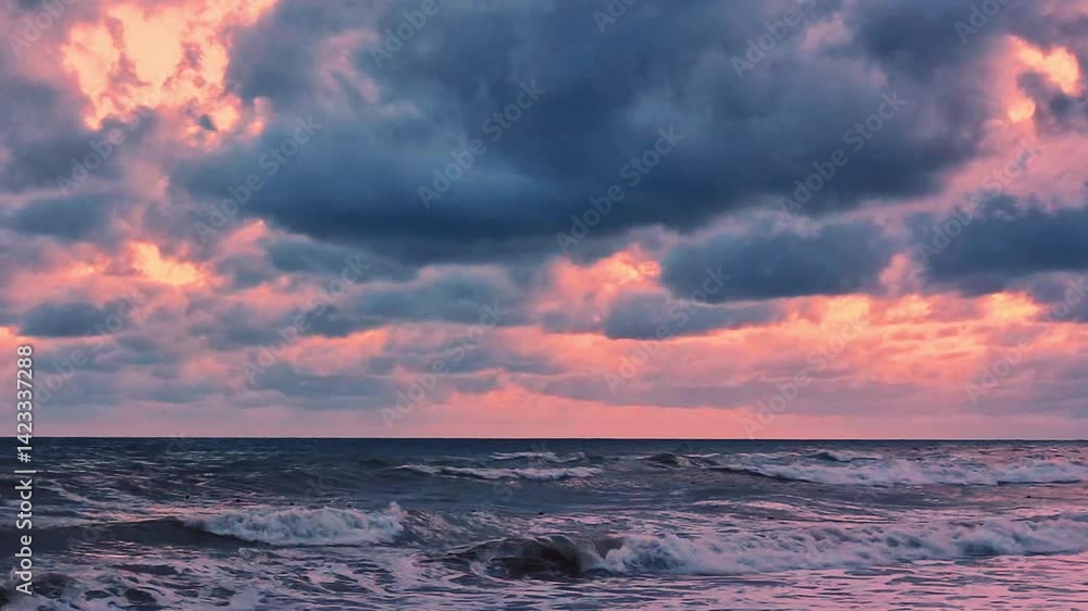 Sea Foaming Waves, Shore, Beach and Thunderstorm, Rainy Sky, Black Dark Gray Storm Clouds Pink Coral Orange Yellow Sky Over Ocean Slow Motion, Tropical Sunset, Global Warming, Planet, Travel. Sea Foaming Waves, Shore, Beach and Thunderstorm, Rainy Sky, Black Dark Gray Storm Clouds Pink Coral Orange Yellow Sky Over Ocean Slow Motion, Tropical Sunset, Global Warming, Planet, Travel.