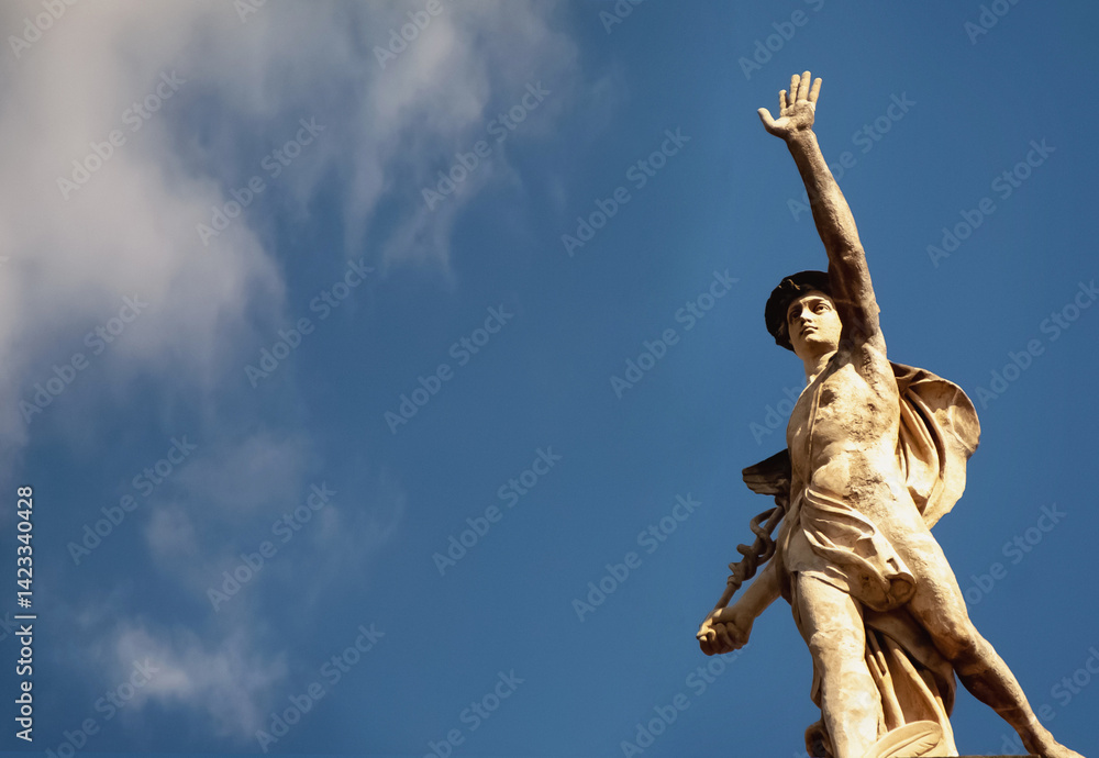 Antique god of commerce, merchants and travelers Hermes (Mercury). Ancient statue on blue background, Copy space.