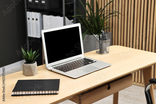 Wallpaper Mural Comfortable workplace with modern laptop on wooden table indoors Torontodigital.ca