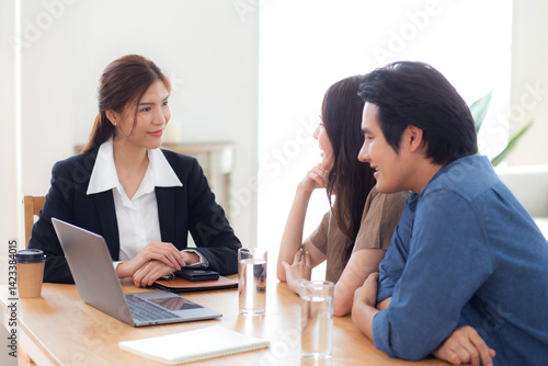 Wallpaper Mural Happy asian couple discussion with real estate agent or insurance agent for investment in home office, mortgage loan or property purchase home, sale explaining insurance plan with couple. Torontodigital.ca