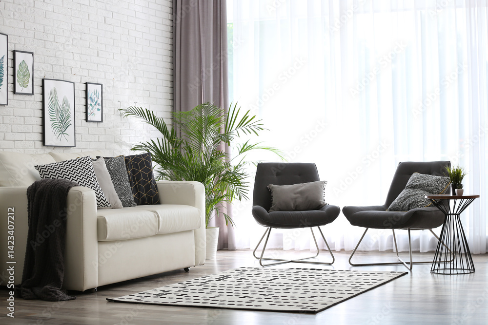 Fototapeta premium Comfortable sofa and chairs near window with elegant curtains in room
