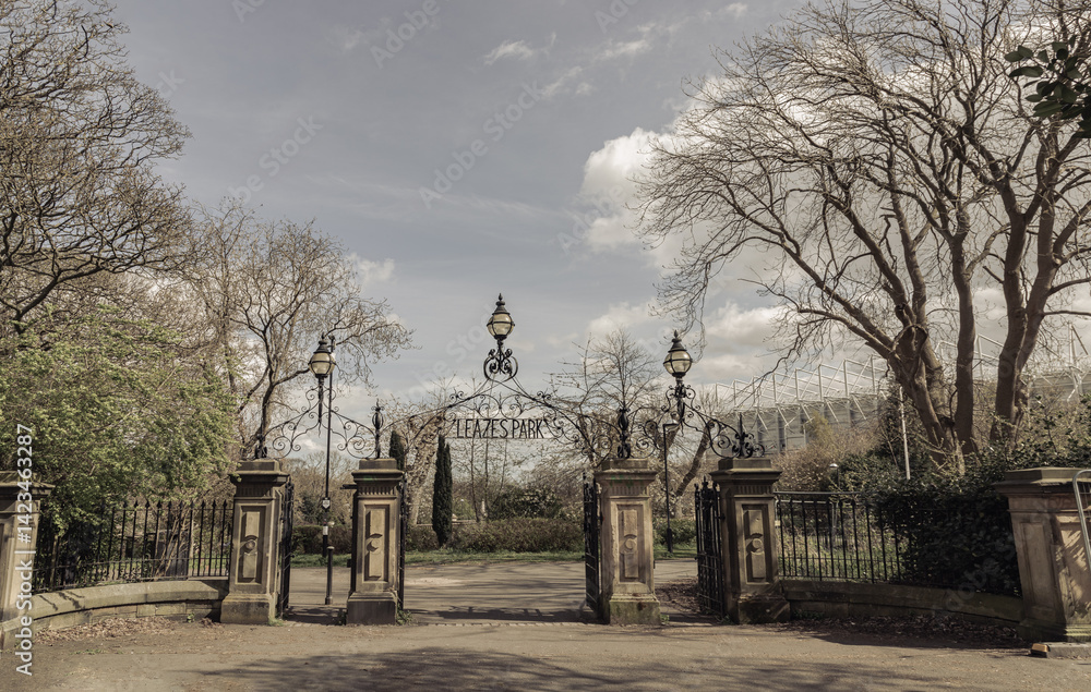 View of Cast iron lamp over the Wrought iron gate is open to the entrance of Leazes park with beautiful sky background. use it as your Wallpaper, Poster and Copy space, Selective focus.