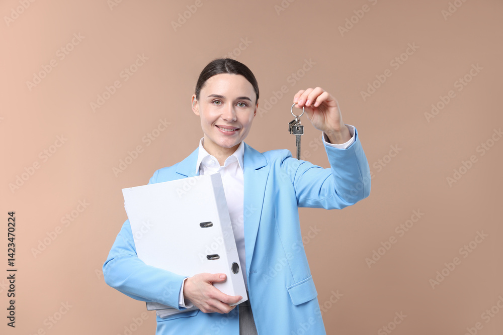 Real estate agent holding key with house shaped keychain and folder on beige background Real estate agent holding key with house shaped keychain and folder on beige background