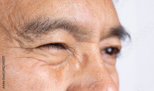 Foto Senior man eye strain after for long stretches at digital screens