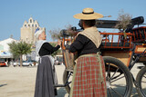 women dressed in Arles style with traditional clothes in the streets of Saintes Maries de la Mer