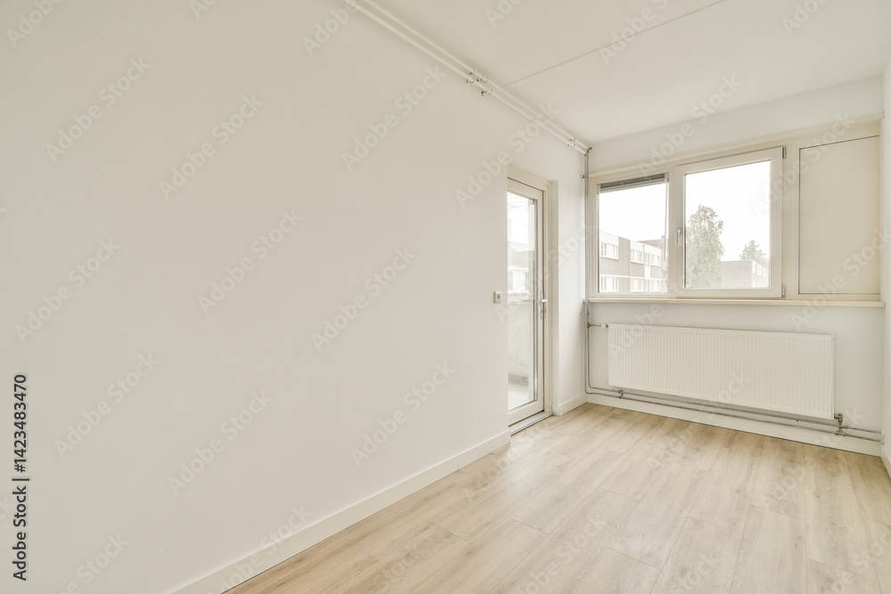 A clean, minimalist interior with ample natural light from large windows, featuring white walls and light wooden flooring, ideal for various design inspirations. A clean, minimalist interior with ample natural light from large windows, featuring white walls and light wooden flooring, ideal for various design inspirations.