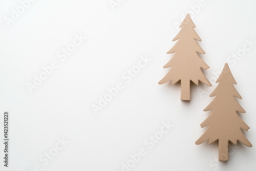Minimalist design featuring two wooden trees on neutral backgrou