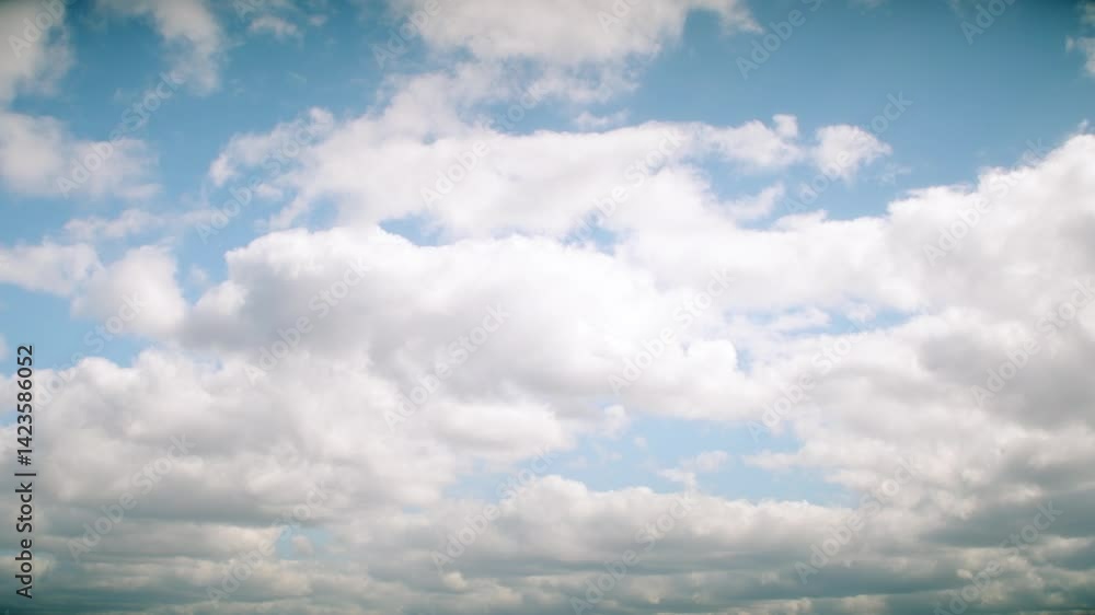 Dramatic sky almost completely covered with cumulus clouds. Slowly moving huge clouds. Atmosphere before a storm or rain. Dramatic sky almost completely covered with cumulus clouds. Slowly moving huge clouds. Atmosphere before a storm or rain.