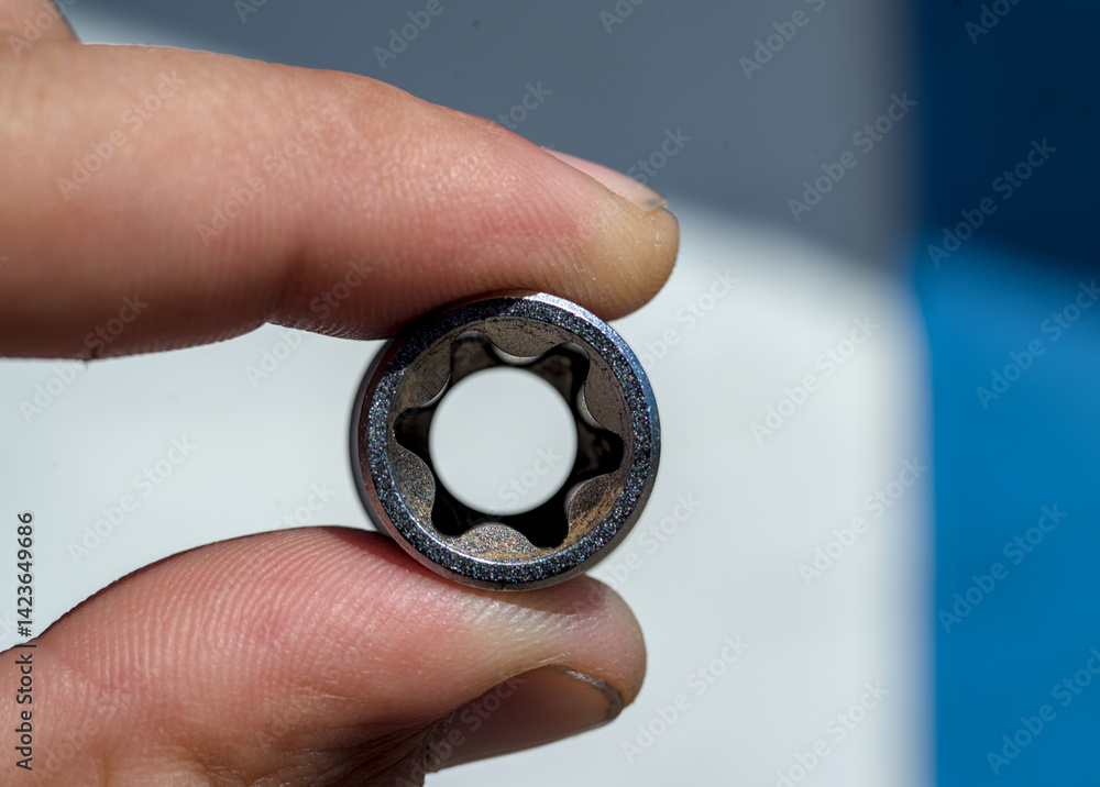 Socket wrench in human hand