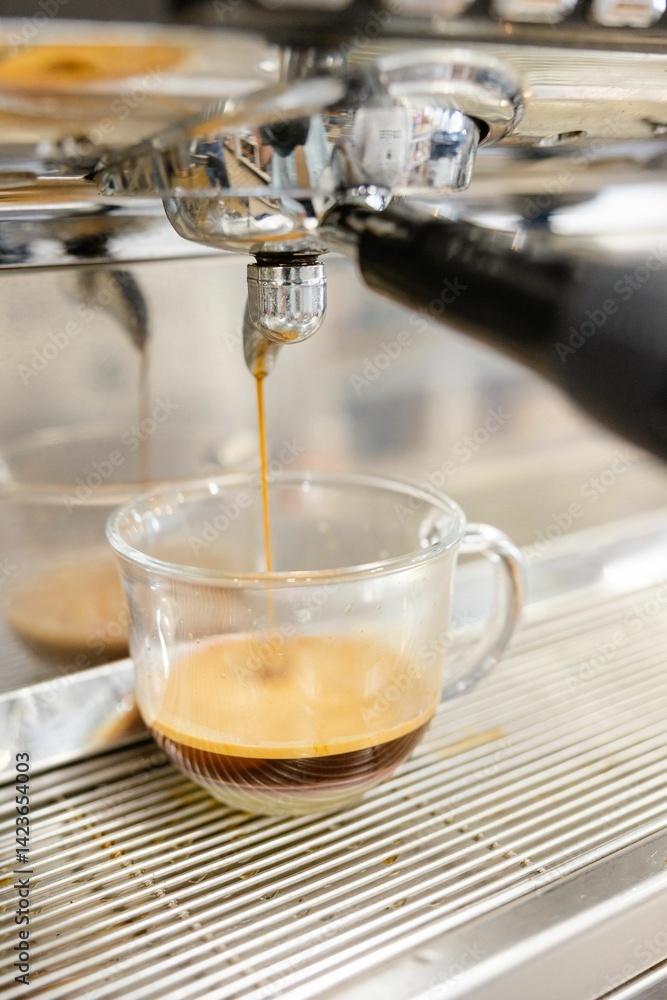 Espresso Pouring into Glass Cup Espresso Pouring into Glass Cup