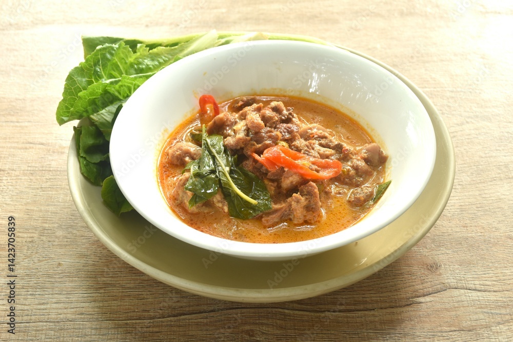 spicy boiled beef meat with eggplant in coconut milk red curry soup on bowl eat couple fresh cos vegetable spicy boiled beef meat with eggplant in coconut milk red curry soup on bowl eat couple fresh cos vegetable