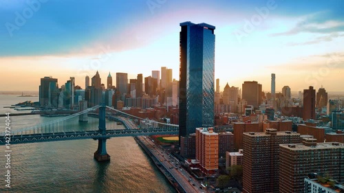 Wallpaper Mural Drone descends above the waterscape of the East River. Sunny view of New York with the view on the Manhattan Bridge and Brooklyn Bridge at sunset. Torontodigital.ca