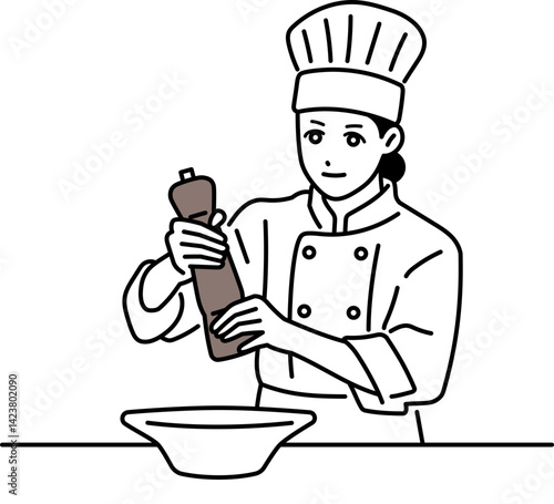 ペッパーミルを使っている女性の料理人