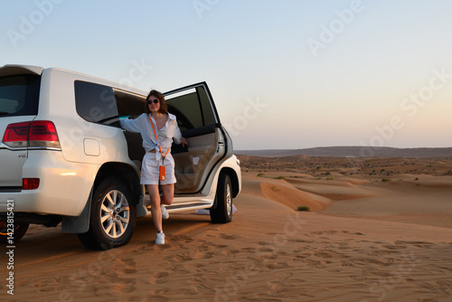 Drive by dunes. Wahiba Sands. Sultanate of Oman. gets out car