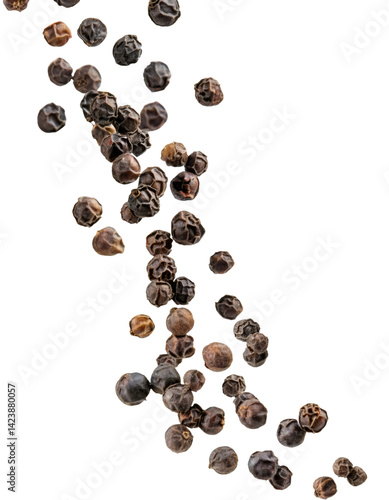 Black peppercorns falling against transparent background, clipping path included