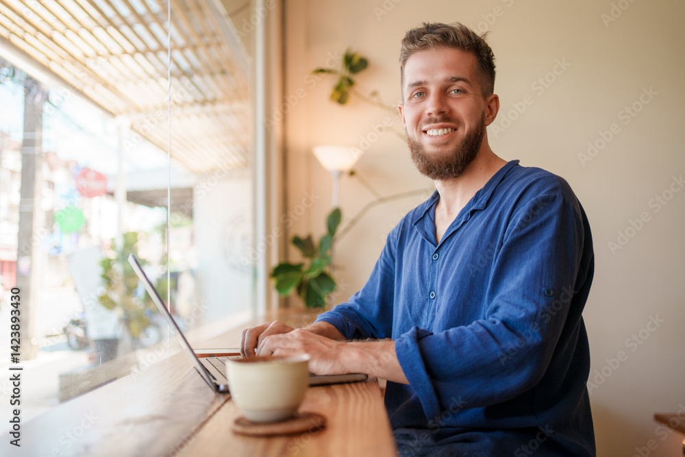 Man Working on Laptop in Stylish Caf Environment Man Working on Laptop in Stylish Caf Environment