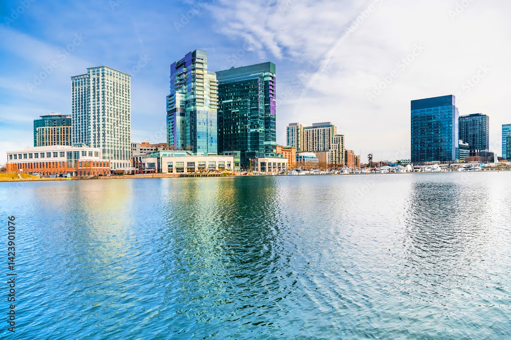 Baltimore's inner harbor with the Skyscrapers of business centers reflecting in the water. Baltimore's inner harbor with the Skyscrapers of business centers reflecting in the water.