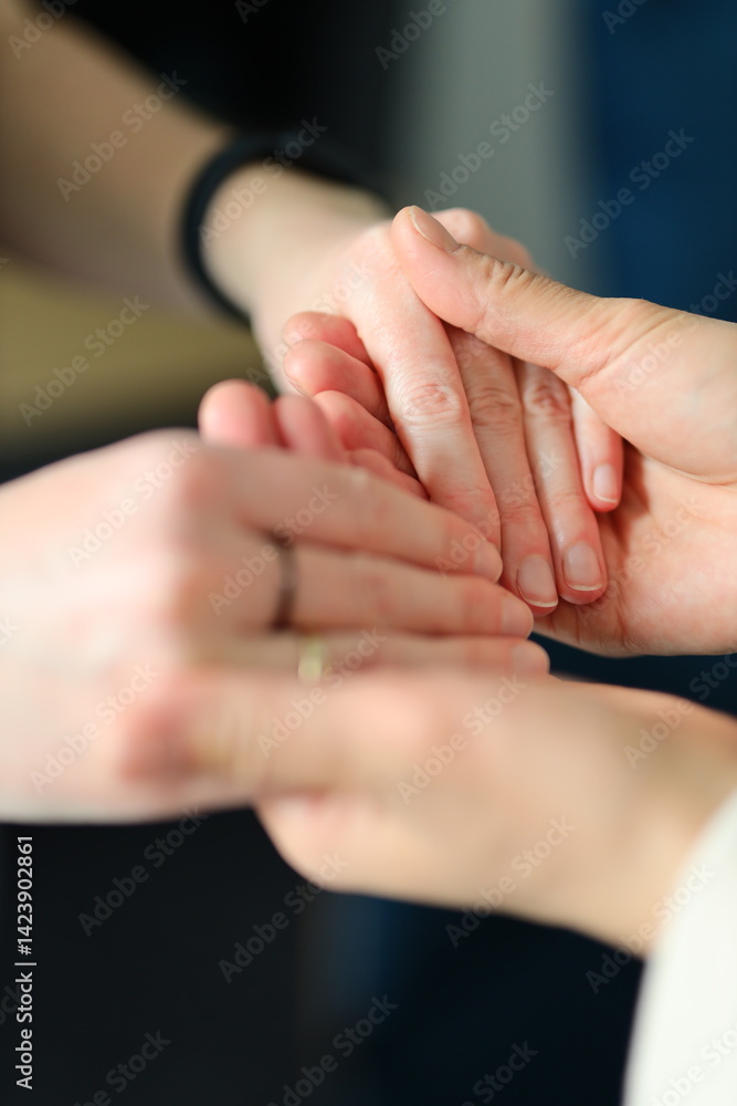 A group of people are holding hands, possibly to show support or solidarity. Concept of unity and togetherness A group of people are holding hands, possibly to show support or solidarity. Concept of unity and togetherness