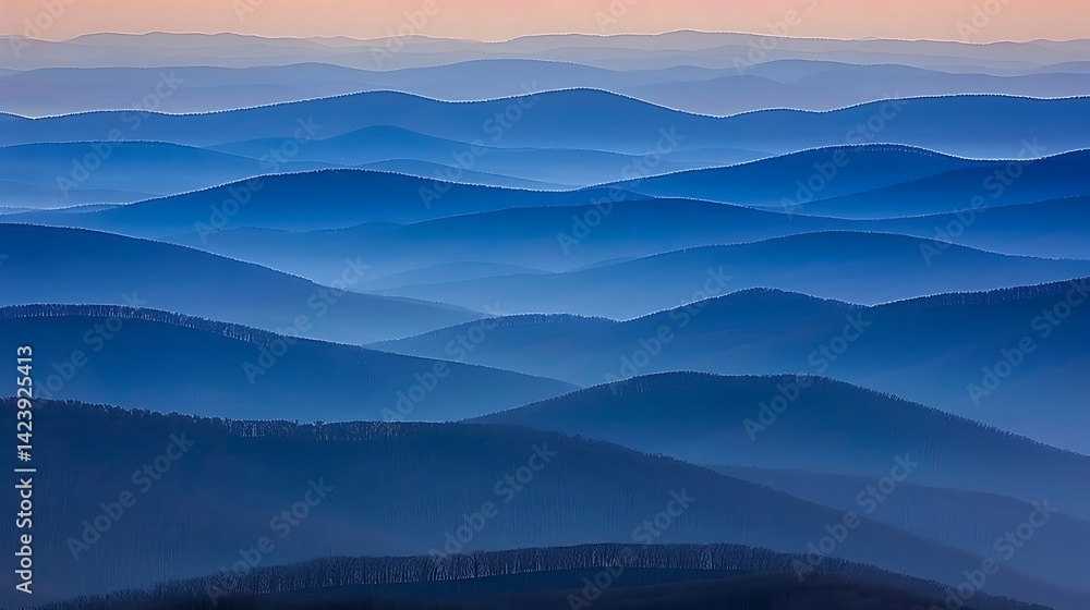 Obraz premium Layers of blue mountains: A serene landscape with misty mountain ridges