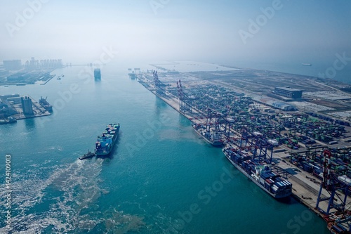 Photography An aerial view of Taipei Port reveals rows of colorful shipping containers, towe