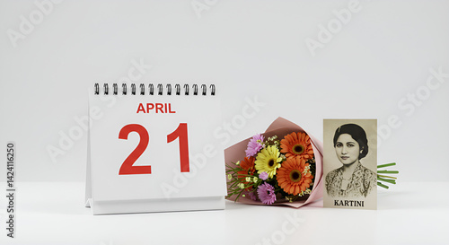 A calendar page showing April 21 with a bouquet of flowers and Kartini’s portrait beside it, clean studio white background