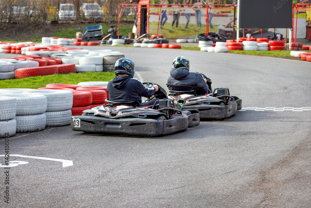 Exciting kart racing competition unfolds on a vibrant outdoor track in springtime