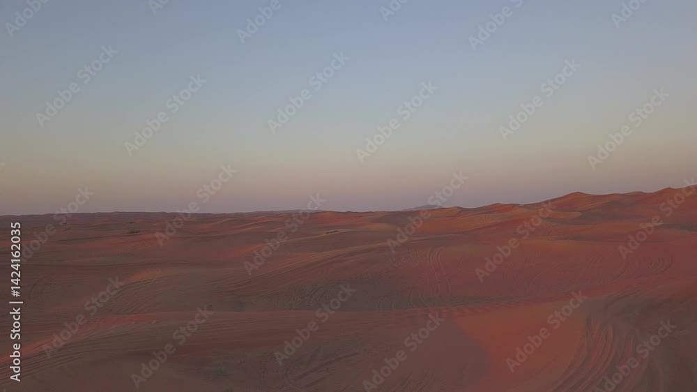 Waves of golden sand at dusk in a serene desert landscape Waves of golden sand at dusk in a serene desert landscape