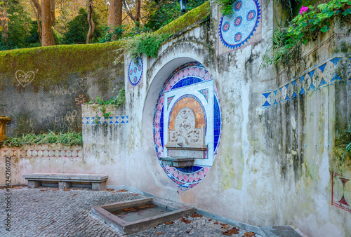 Sintra, Portugal - October 27 2024: Fonte dos Pisões, a fountain that dates back to Roman times, in the lush greenery of Sintra-Cascais Natural Park.