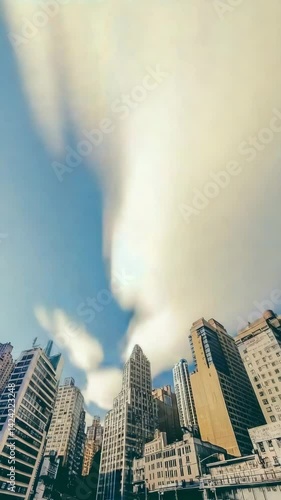 The fast moving clouds over modern skyline, time-lapse style