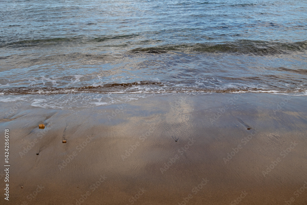 Sand beach and a line of the tide, Gran Canaria, Spain Sand beach and a line of the tide, Gran Canaria, Spain