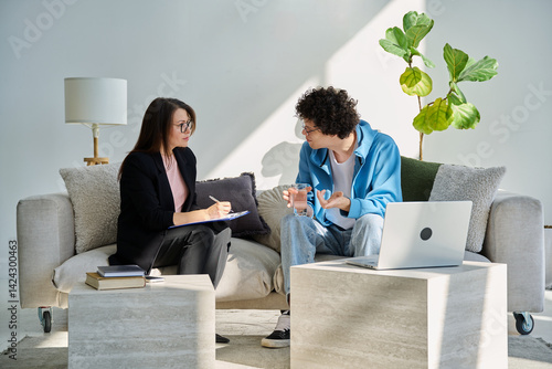 Mental therapy session, young guy talking with female psychologist, in office