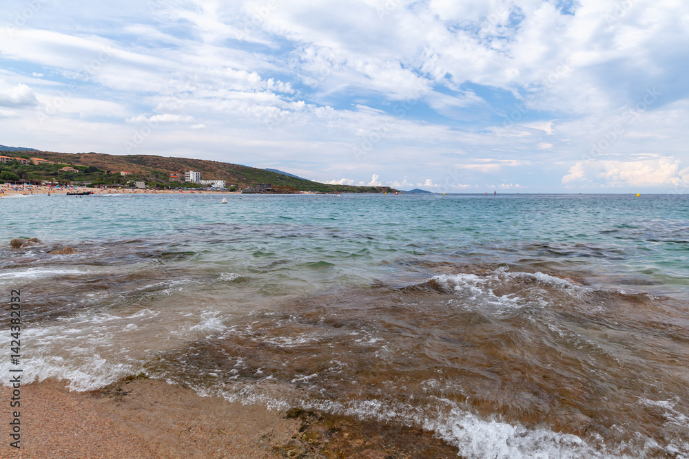 Peaceful coastline scene with gentle waves, a pristine beach. Corsica