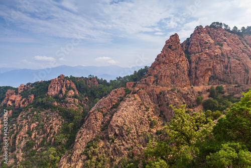 A breathtaking view of rocky hills covered with green foliage, Corsica