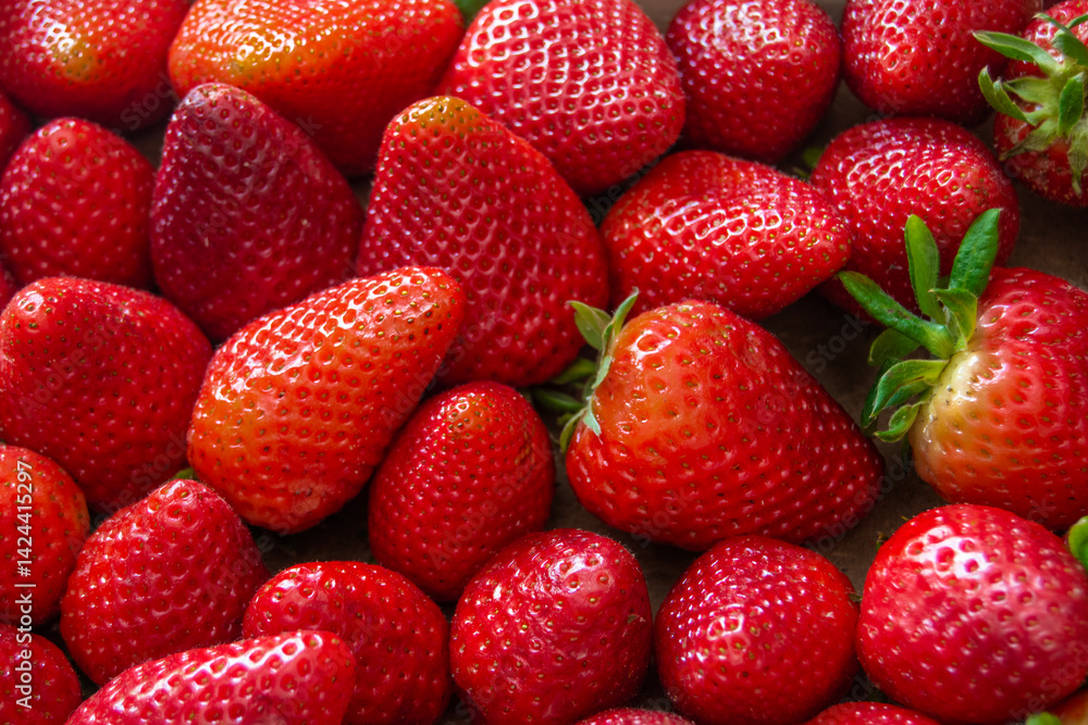 a background with appetizing red strawberries a background with appetizing red strawberries