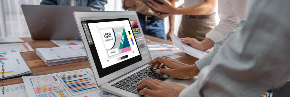 Graphic designer software for modern design of web page and commercial brisk ads showing on the computer screen