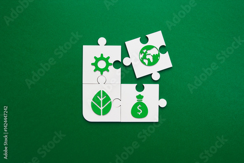 Sustainable Business Puzzle with Environmental Icons. puzzle pieces featuring green sustainability symbols including gear, globe, leaf, and money bag on green background. Environmental strategy