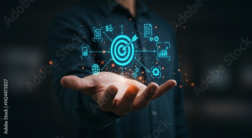 Obraz na płótnie Man displaying digital target with icons in hand, concept of business planning, goal setting, strategy, and online marketing for digital transformation w salonie