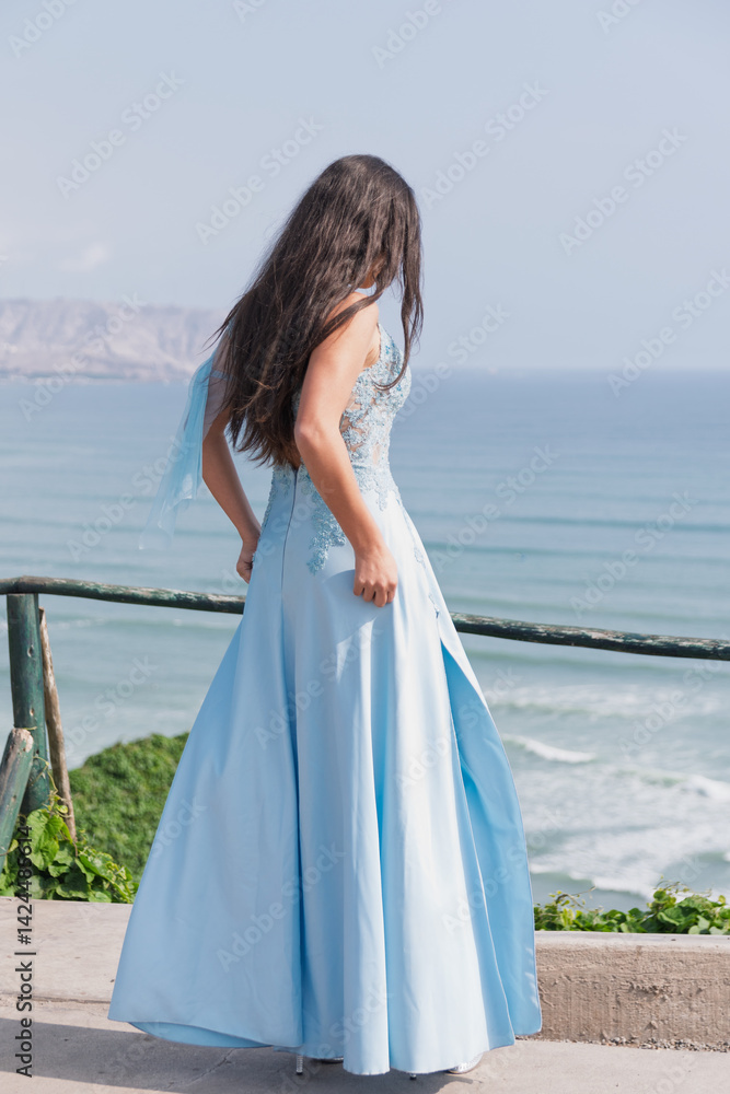 Peruvian, beautiful, young model taking photos in front of the sea, makeup, natural hairstyle, loose hair, landscape, green coast of Peru, Lima Peruvian, beautiful, young model taking photos in front of the sea, makeup, natural hairstyle, loose hair, landscape, green coast of Peru, Lima