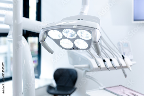 Close-up of sterilised dentist's instruments for working on teeth arranged on medical cabinet. Dental health concept