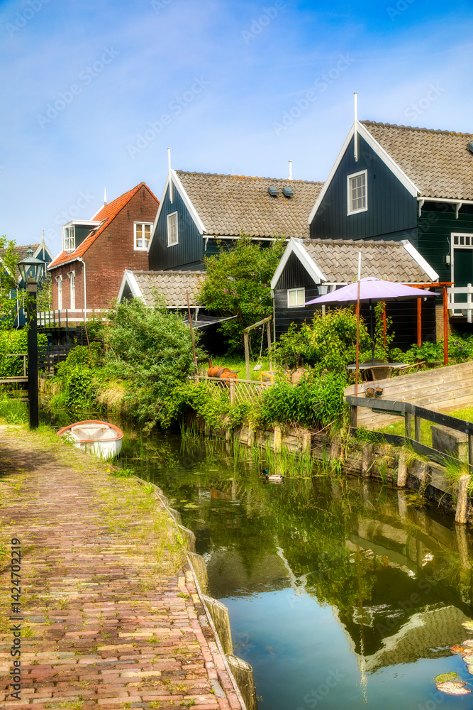 A Canal in the Beautiful Village of Marken on the Marken Peninsula, Netherlands A Canal in the Beautiful Village of Marken on the Marken Peninsula, Netherlands
